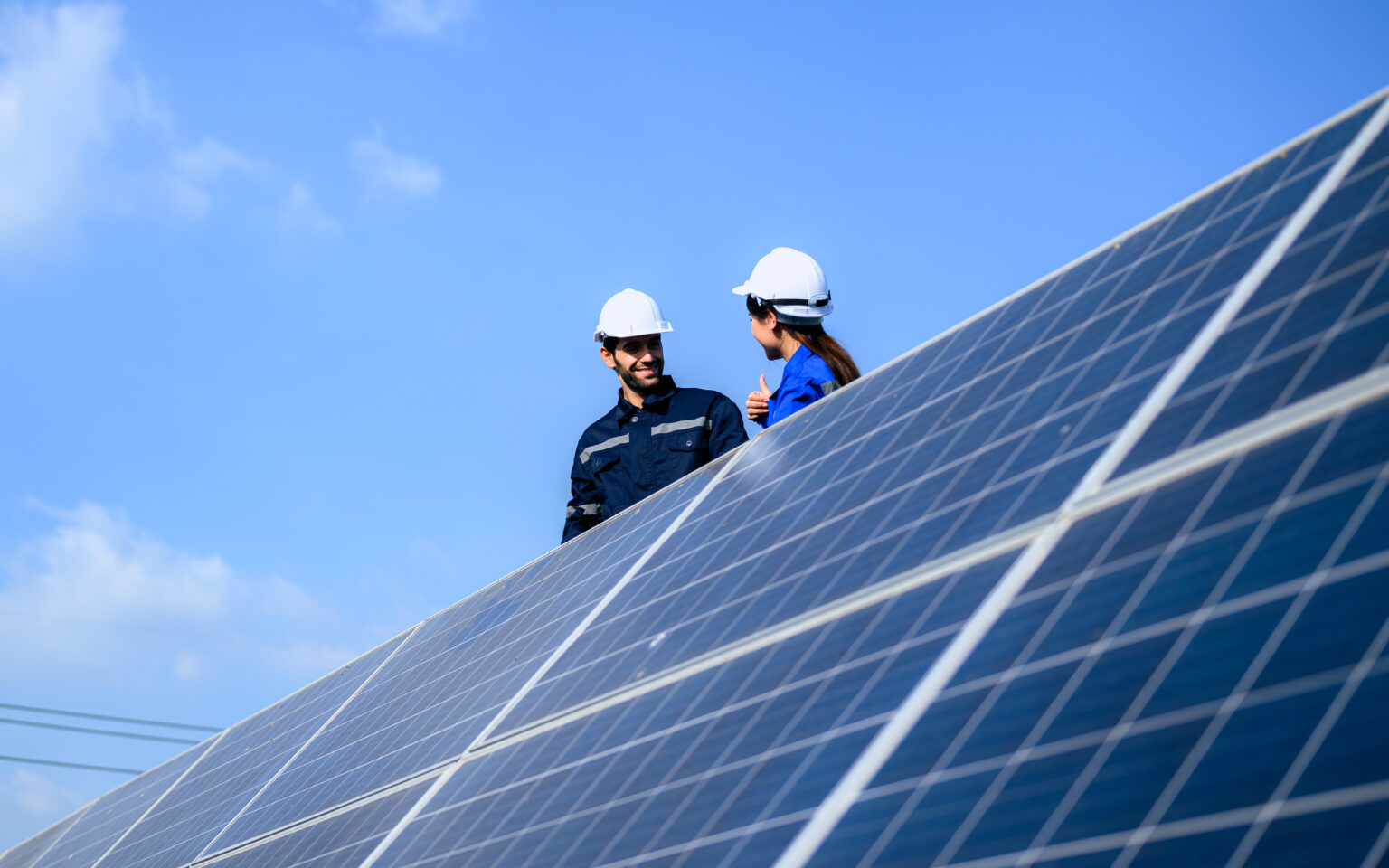 solar-panel-station-engineer-installing-solar-panel-at-solar-energy-farm-field